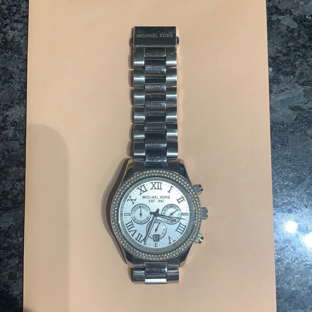 Crystal embellished Michael Kors women’s watch.